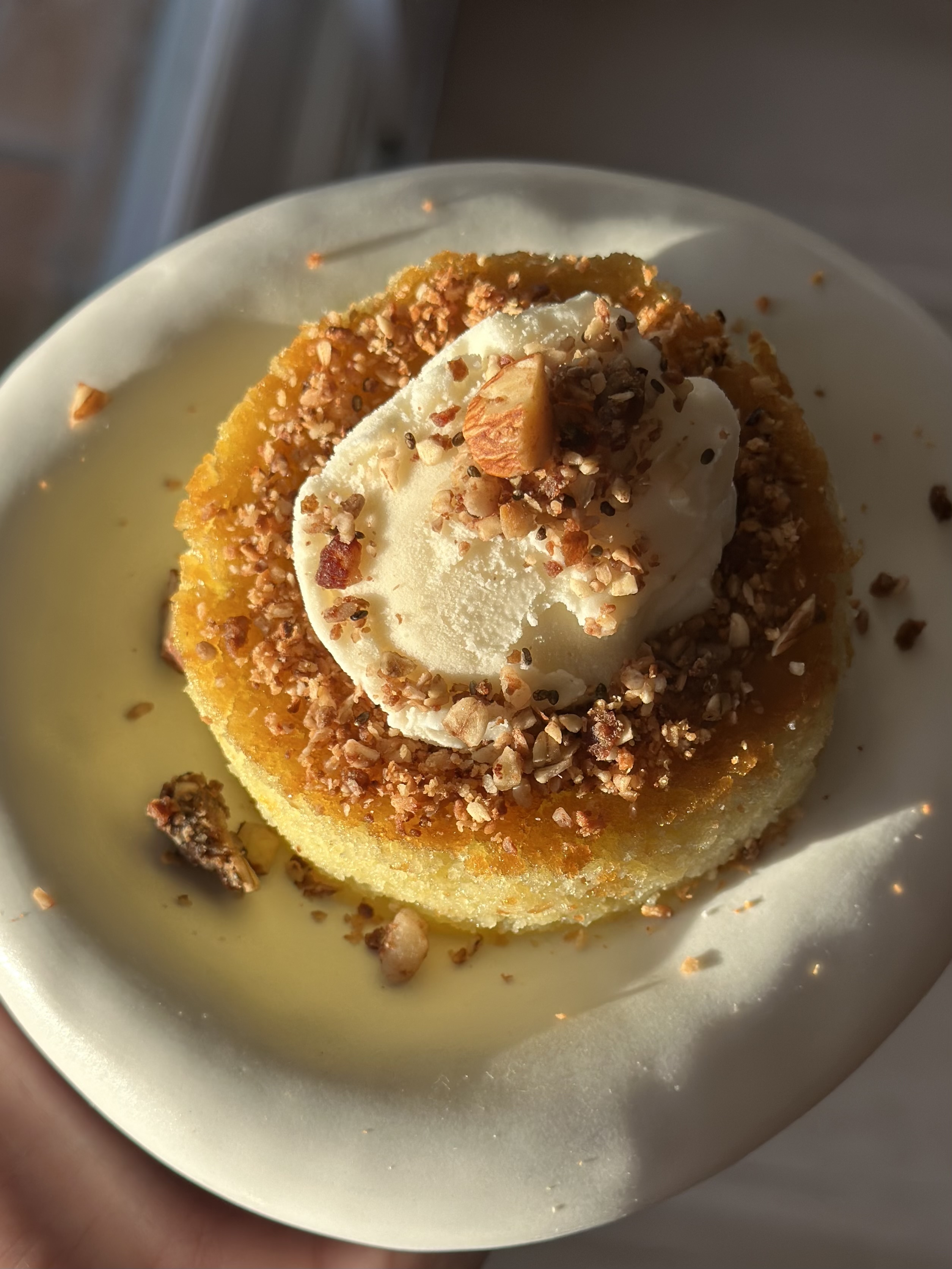 Revani semolina cake served with ice cream — top-down view