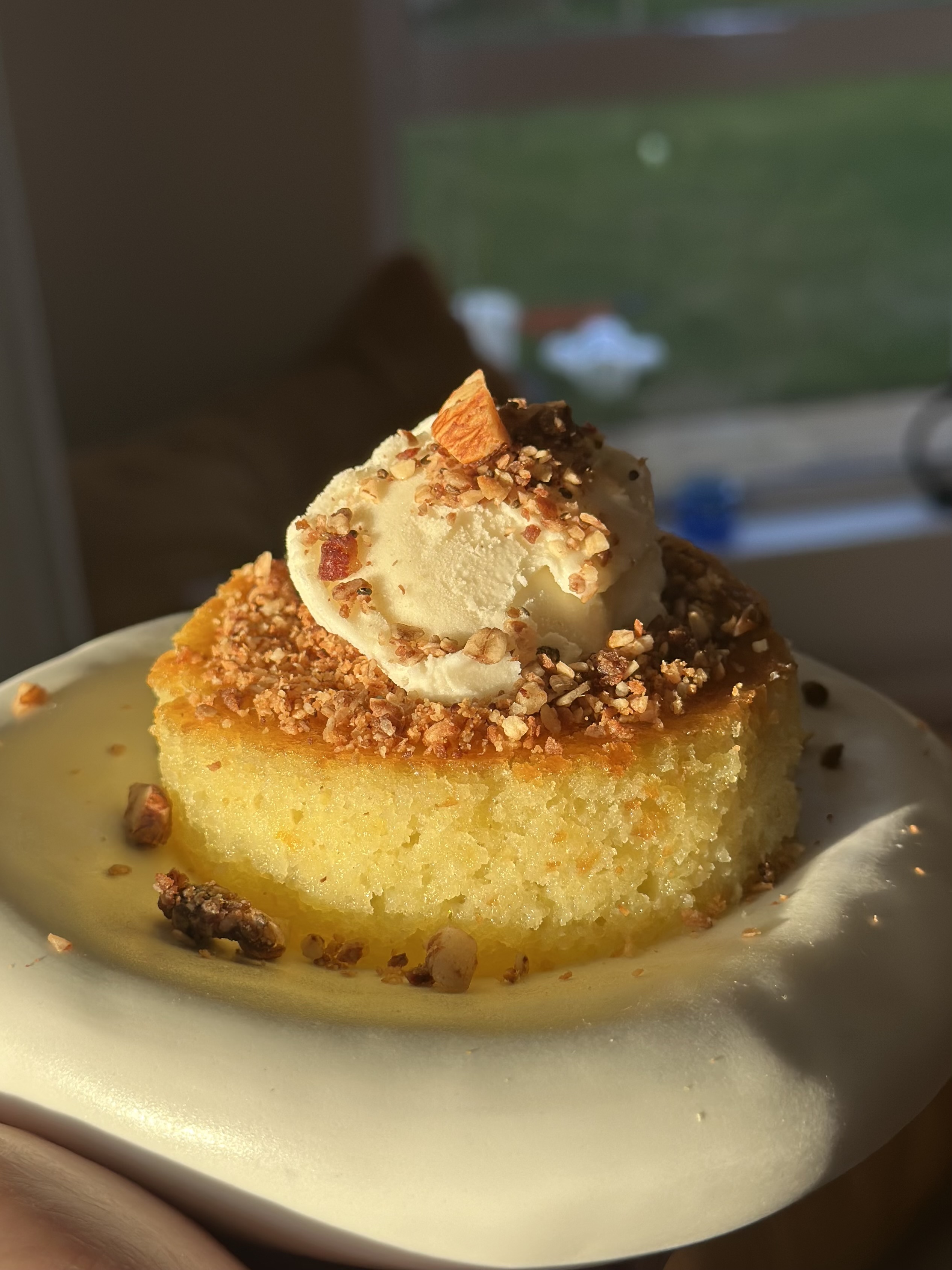 Revani semolina cake soaked in syrup, close-up warm light
